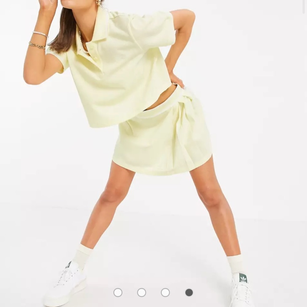 adidas Originals Tennis Luxe logo pleated skirt in hazy yellow